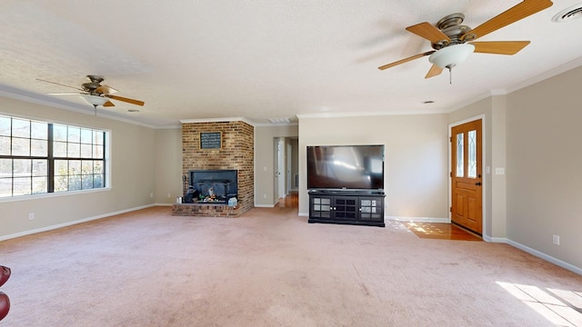 unfurnished living room featuring visible vents, ornamental molding, carpet floors, a fireplace, and a ceiling fan