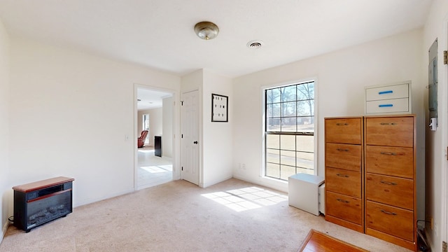 bedroom featuring light colored carpet and visible vents