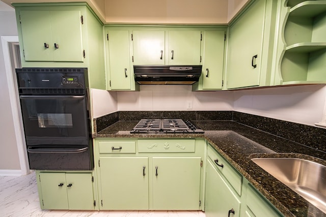 kitchen featuring a warming drawer, a sink, under cabinet range hood, black oven, and marble finish floor