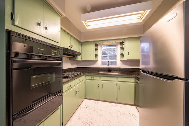 kitchen featuring green cabinets, under cabinet range hood, marble finish floor, black appliances, and a sink