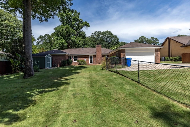 6215 Seaton Dr, Columbus, GA 31909 - view of yard with a shed, driveway, and a garage