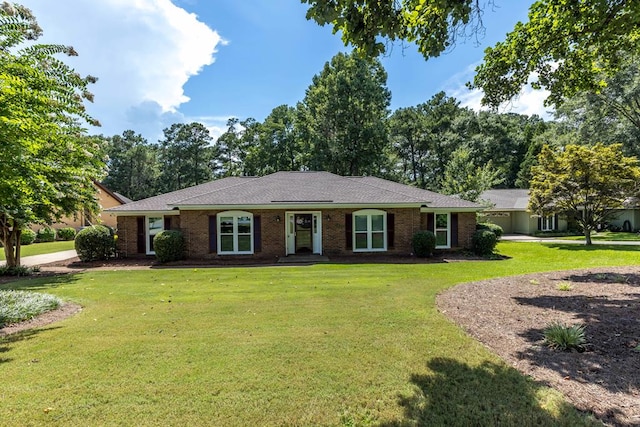 6215 Seaton Dr, Columbus, GA 31909 - ranch-style home featuring a front lawn and brick siding