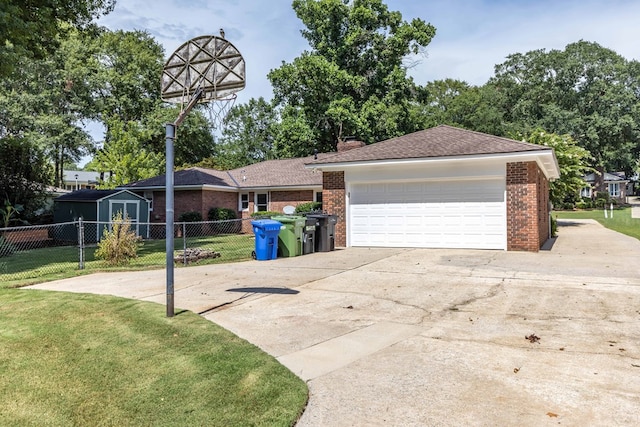 6215 Seaton Dr, Columbus, GA 31909 - view of front of property with concrete driveway, brick siding, and a storage unit