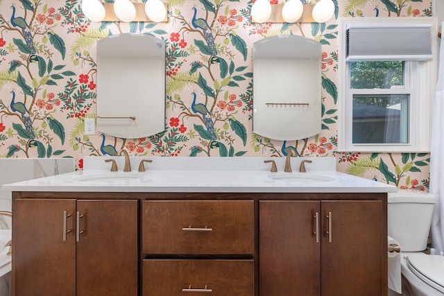 6215 Seaton Dr, Columbus, GA 31909 - bathroom featuring wallpapered walls and double vanity