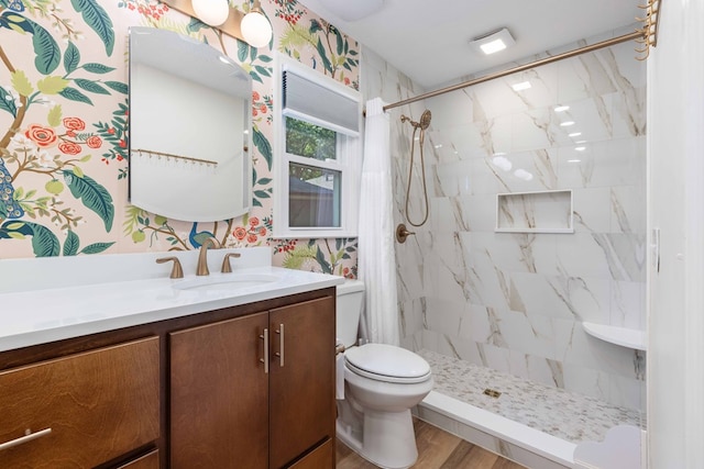 6215 Seaton Dr, Columbus, GA 31909 - full bathroom with vanity, a stall shower, and wood finished floors