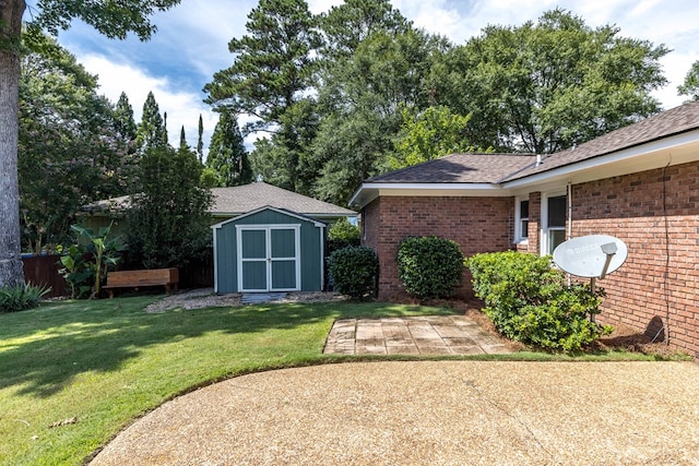 6215 Seaton Dr, Columbus, GA 31909 - view of grassy yard with a storage shed and a patio area