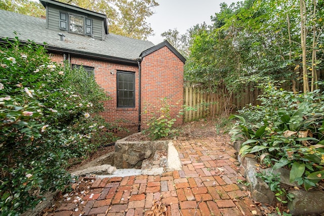 view of side of property with a patio