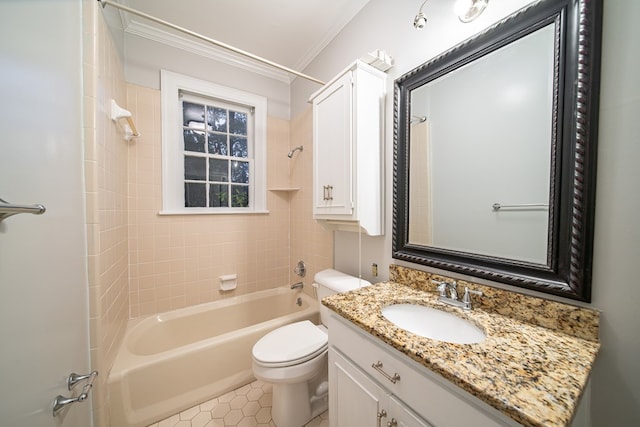 full bathroom featuring vanity, tiled shower / bath combo, toilet, and crown molding