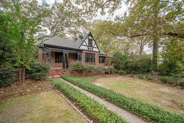 tudor house with a front yard