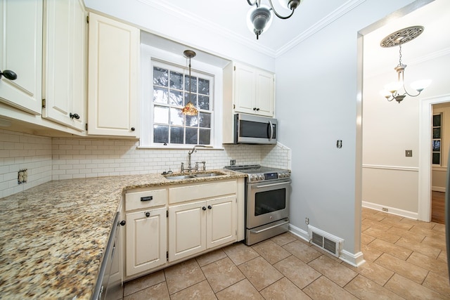 2010 Cherokee Dr, Columbus, GA 31906 - kitchen with stainless steel appliances, tasteful backsplash, crown molding, pendant lighting, and light stone countertops