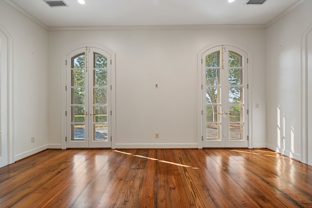 entryway with french doors, a healthy amount of sunlight, and wood-type flooring