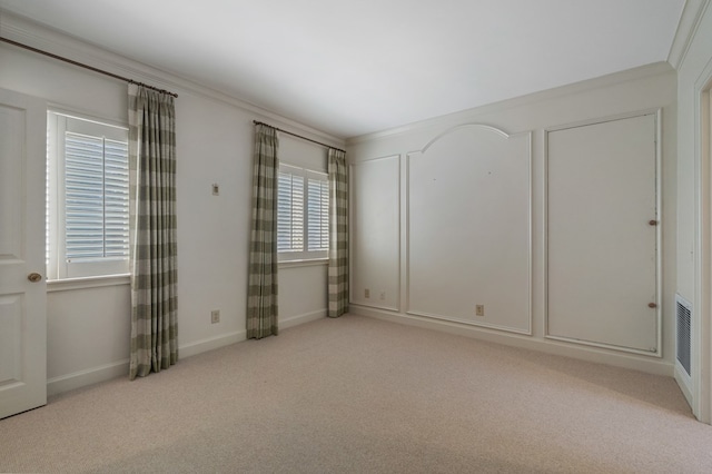 unfurnished bedroom with light carpet and ornamental molding