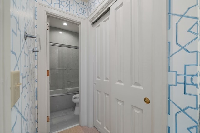 bathroom featuring tile patterned flooring and toilet