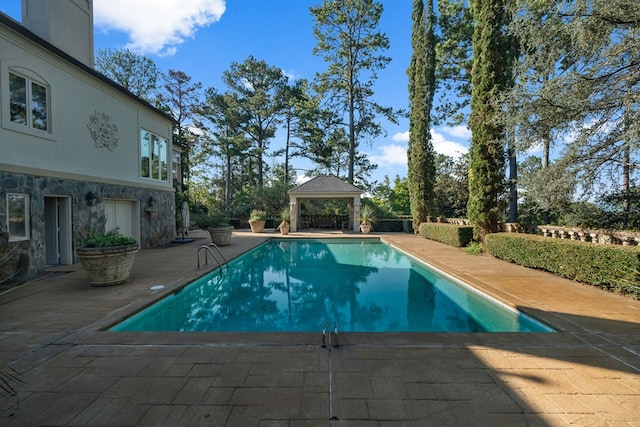 view of swimming pool featuring a gazebo and a patio