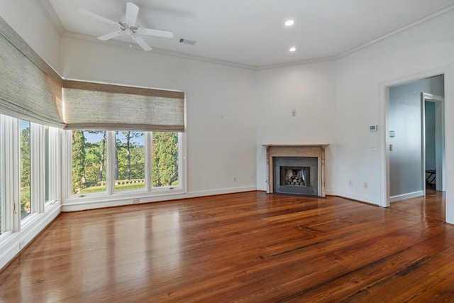 unfurnished living room with ceiling fan, ornamental molding, and hardwood / wood-style flooring