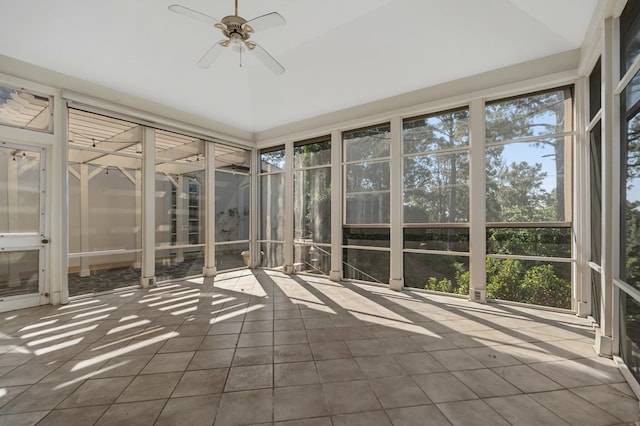 unfurnished sunroom featuring ceiling fan and vaulted ceiling