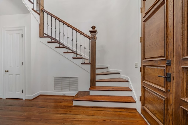 stairs with wood-type flooring