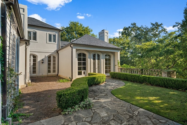 back of property featuring french doors