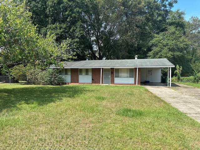 ranch-style house featuring a carport and a front yard