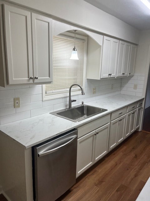 kitchen featuring white cabinetry, stainless steel dishwasher, dark hardwood / wood-style floors, and sink