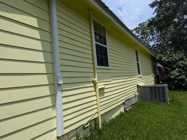 view of side of property featuring central AC unit