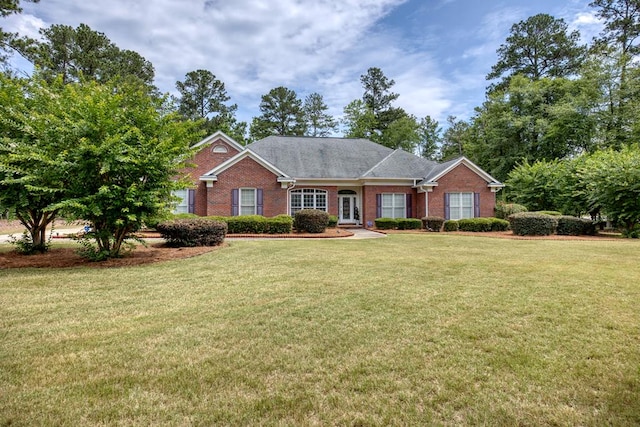 1000 Gramercy Dr, Midland, GA 31820 - ranch-style house with brick siding and a front yard