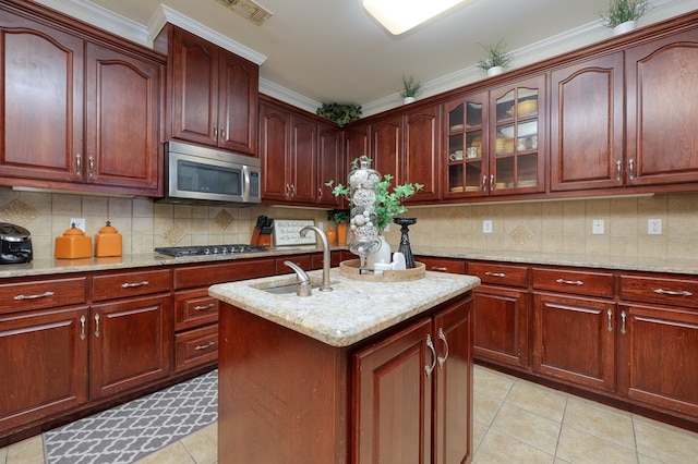 1000 Gramercy Dr, Midland, GA 31820 - kitchen with stainless steel appliances, a sink, light tile patterned floors, light stone counters, and crown molding