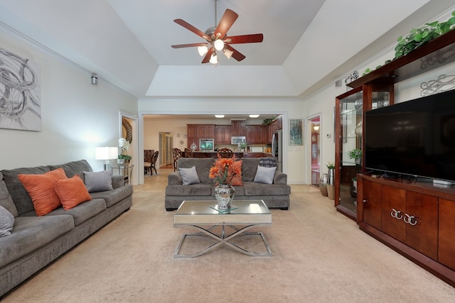 1000 Gramercy Dr, Midland, GA 31820 - living room featuring a tray ceiling, light carpet, and ceiling fan