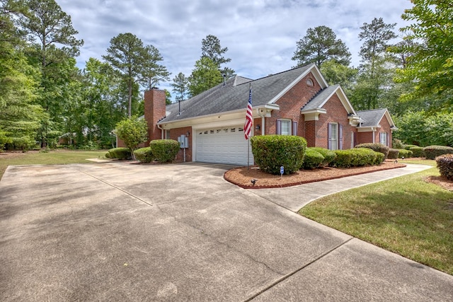 1000 Gramercy Dr, Midland, GA 31820 - view of side of property featuring brick siding, a garage, driveway, and a yard