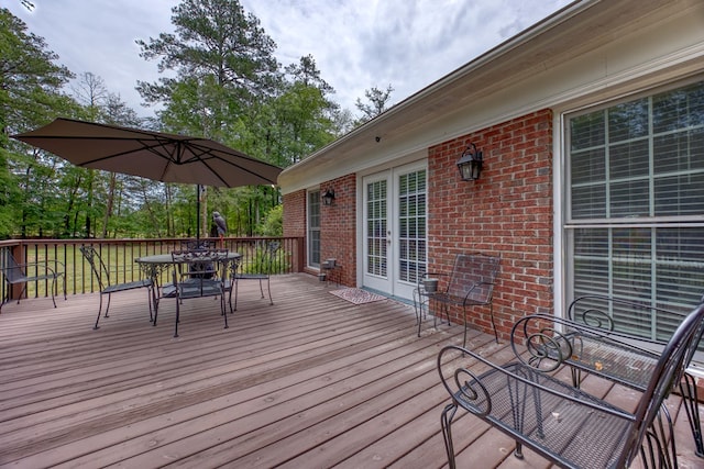 1000 Gramercy Dr, Midland, GA 31820 - wooden terrace with outdoor dining space and french doors