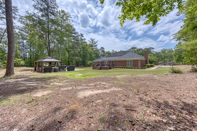 1000 Gramercy Dr, Midland, GA 31820 - view of green lawn with a gazebo and a wooden deck