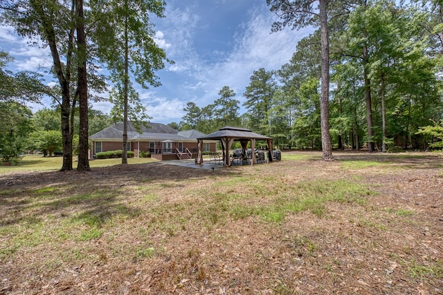 1000 Gramercy Dr, Midland, GA 31820 - view of green lawn with a gazebo and a patio area