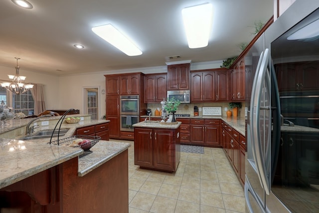 1000 Gramercy Dr, Midland, GA 31820 - kitchen featuring stainless steel appliances, a sink, tasteful backsplash, a center island, and a chandelier