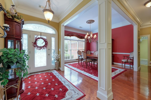 1000 Gramercy Dr, Midland, GA 31820 - entryway featuring crown molding, a chandelier, light wood-type flooring, and baseboards