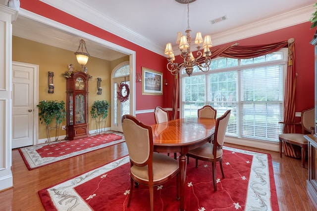 1000 Gramercy Dr, Midland, GA 31820 - dining area with a chandelier, wood finished floors, ornamental molding, and baseboards