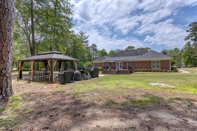 1000 Gramercy Dr, Midland, GA 31820 - view of green lawn with a gazebo and a wooden deck