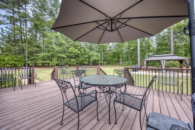1000 Gramercy Dr, Midland, GA 31820 - wooden terrace with outdoor dining space, a gazebo, a lawn, and view of scattered trees