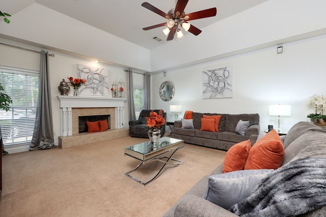 1000 Gramercy Dr, Midland, GA 31820 - carpeted living area with ceiling fan, a tile fireplace, and high vaulted ceiling