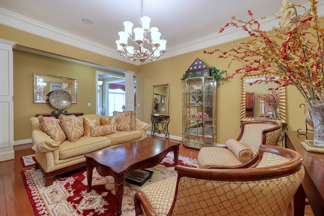 1000 Gramercy Dr, Midland, GA 31820 - living room featuring decorative columns, hardwood / wood-style floors, a chandelier, crown molding, and baseboards