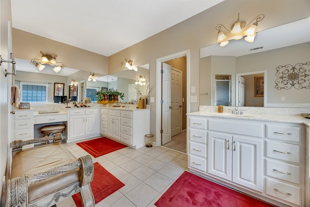 1000 Gramercy Dr, Midland, GA 31820 - bathroom with two vanities, tile patterned floors, and a shower stall