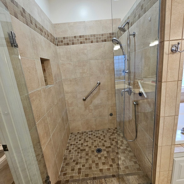 full bath with a shower stall