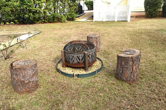 view of yard with an outdoor fire pit