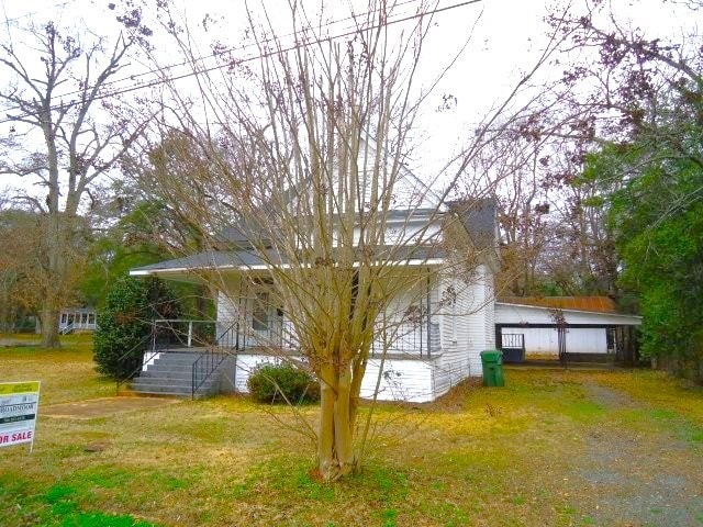 view of property exterior featuring a yard