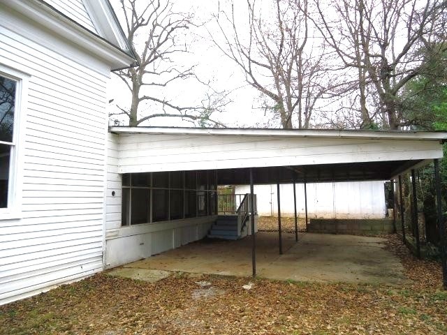 view of parking featuring a carport