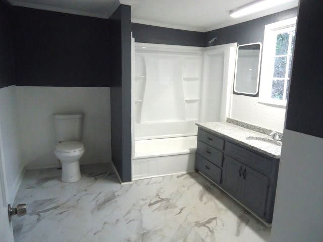 full bathroom featuring vanity,  shower combination, and toilet