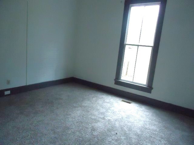 621 Alston St, Richland, GA 31825 - carpeted spare room featuring baseboards