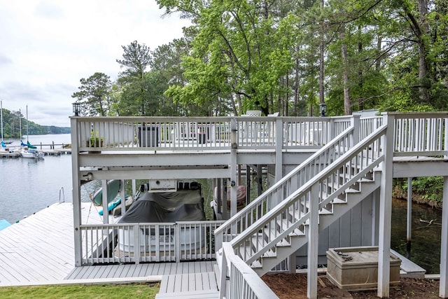 566 Longview Dr, Hamilton, GA 31811 - wooden deck with a water view and a boat dock
