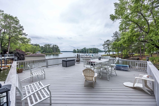 566 Longview Dr, Hamilton, GA 31811 - wooden terrace featuring outdoor dining space and a water view