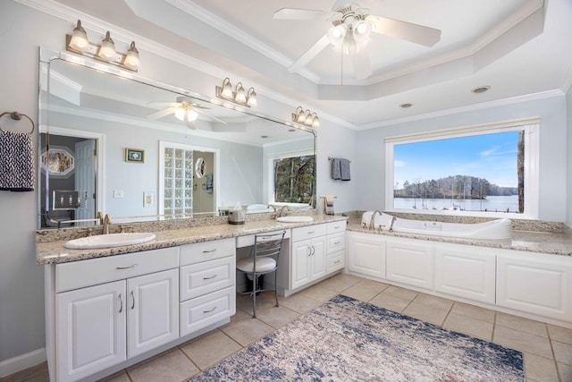 566 Longview Dr, Hamilton, GA 31811 - bathroom featuring a tray ceiling, a ceiling fan, double vanity, a garden tub, and ornamental molding