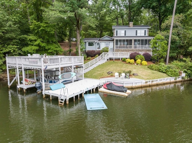 566 Longview Dr, Hamilton, GA 31811 - dock area with a water view, boat lift, stairway, a lawn, and view of scattered trees